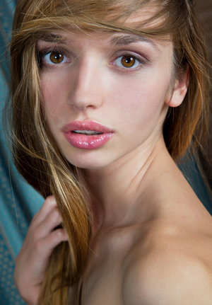 18 year old girl Agnes uncovers her perky tits as she gets completely naked